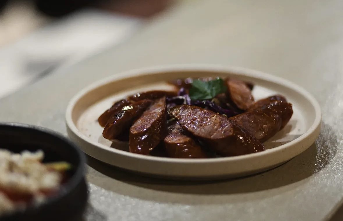 Grilled house sausage with red cabbage